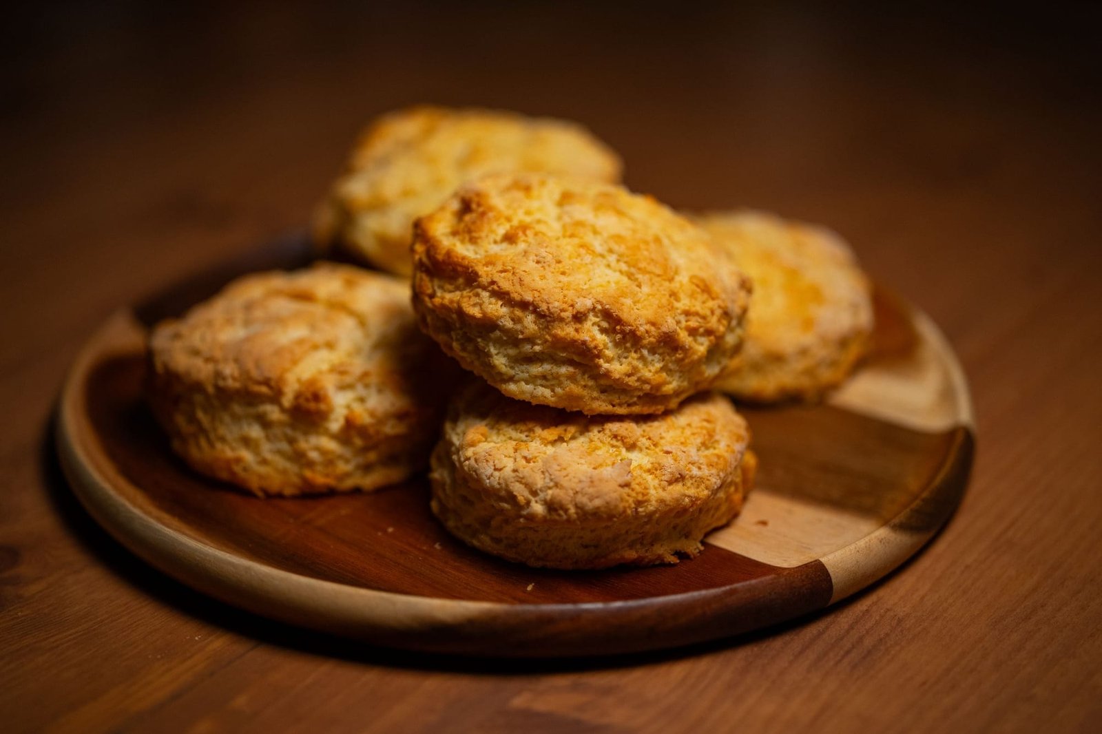 Buttermilk biscuits on a wooden plate