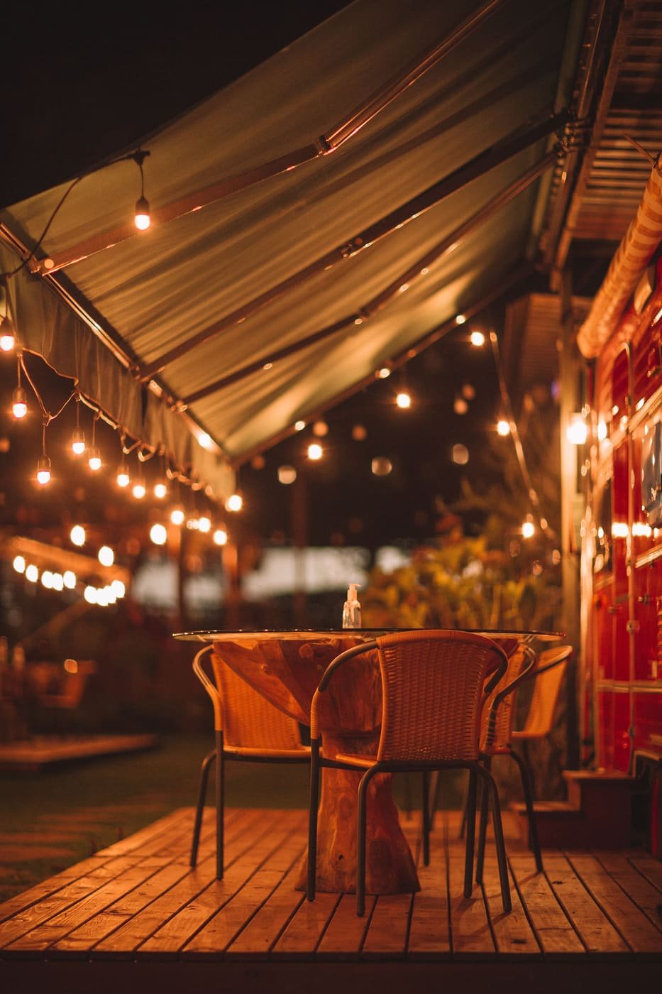 The patio at night under string lights