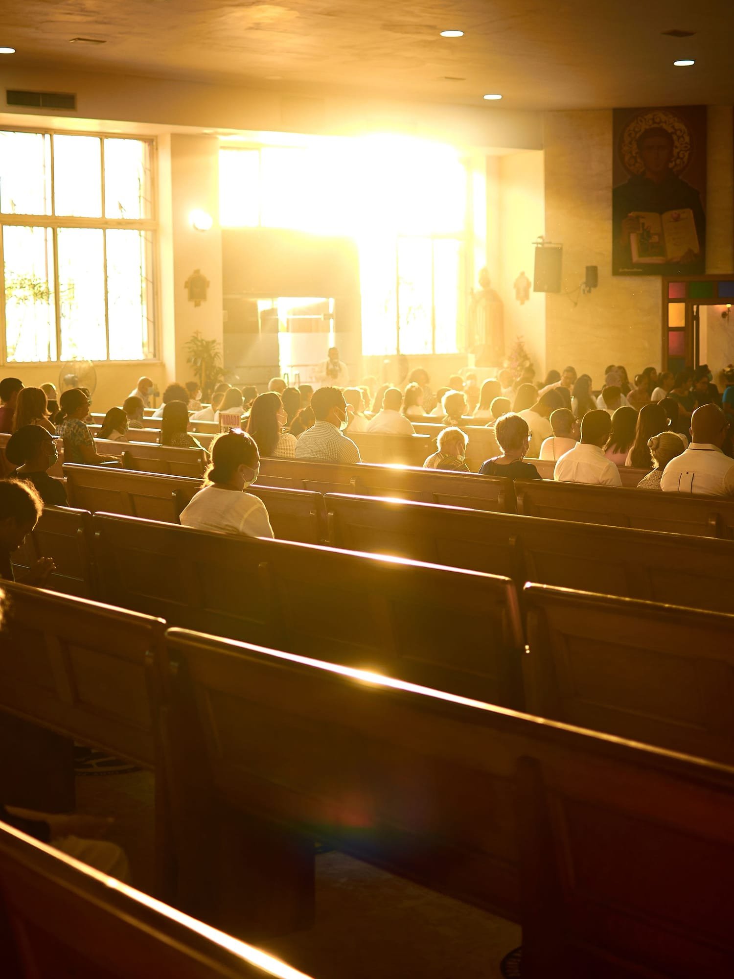 The sanctuary on a Sunday morning, every row full, with the sun pouring in through the side windows