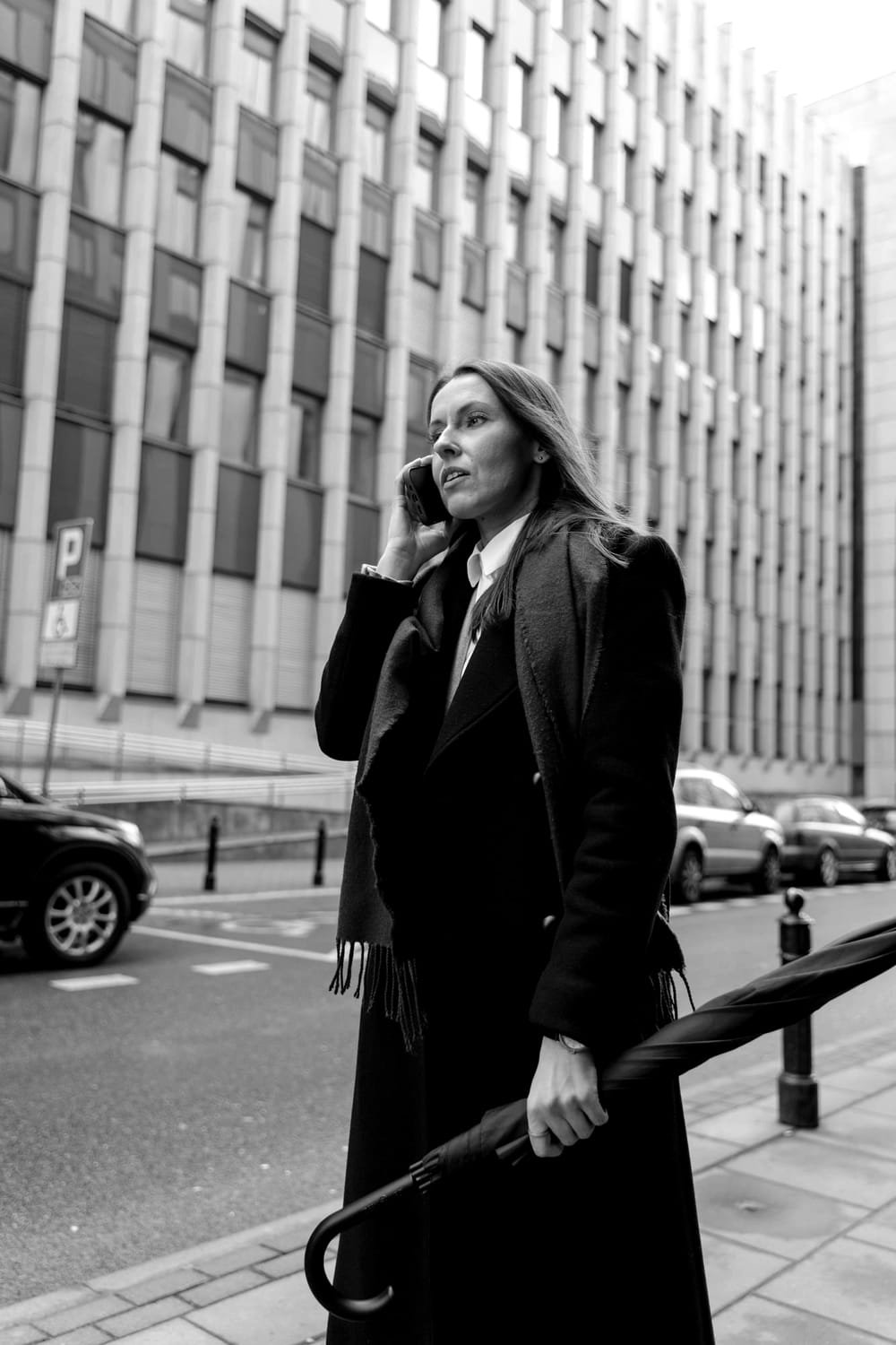 Elena Reyes returning a call on the street outside the office