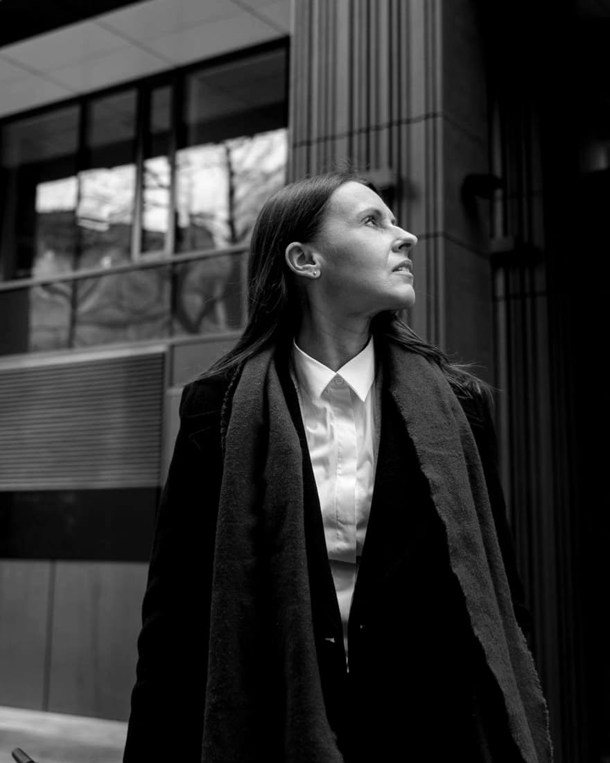 Elena Reyes in a dark coat and scarf