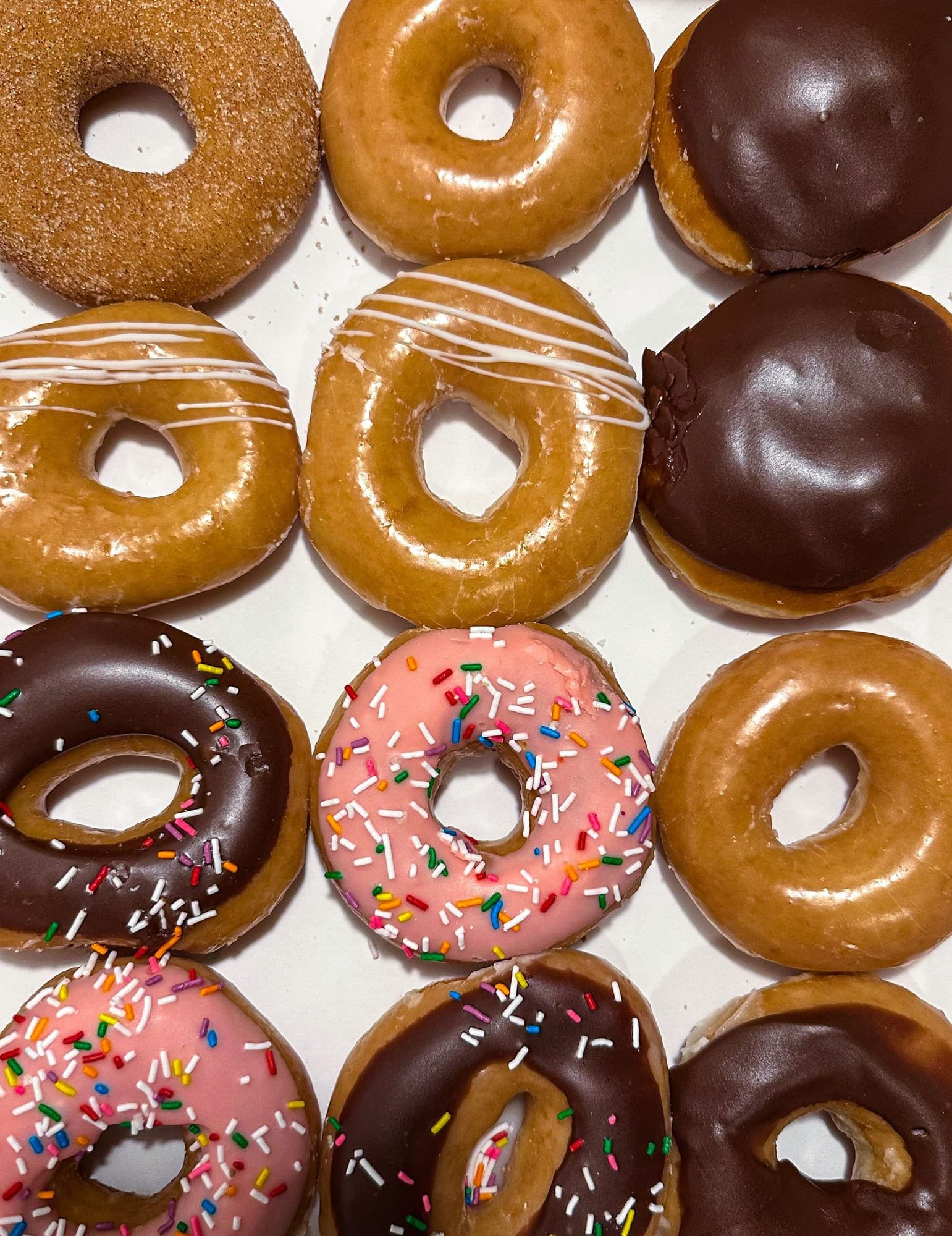 A full box of assorted donuts from above